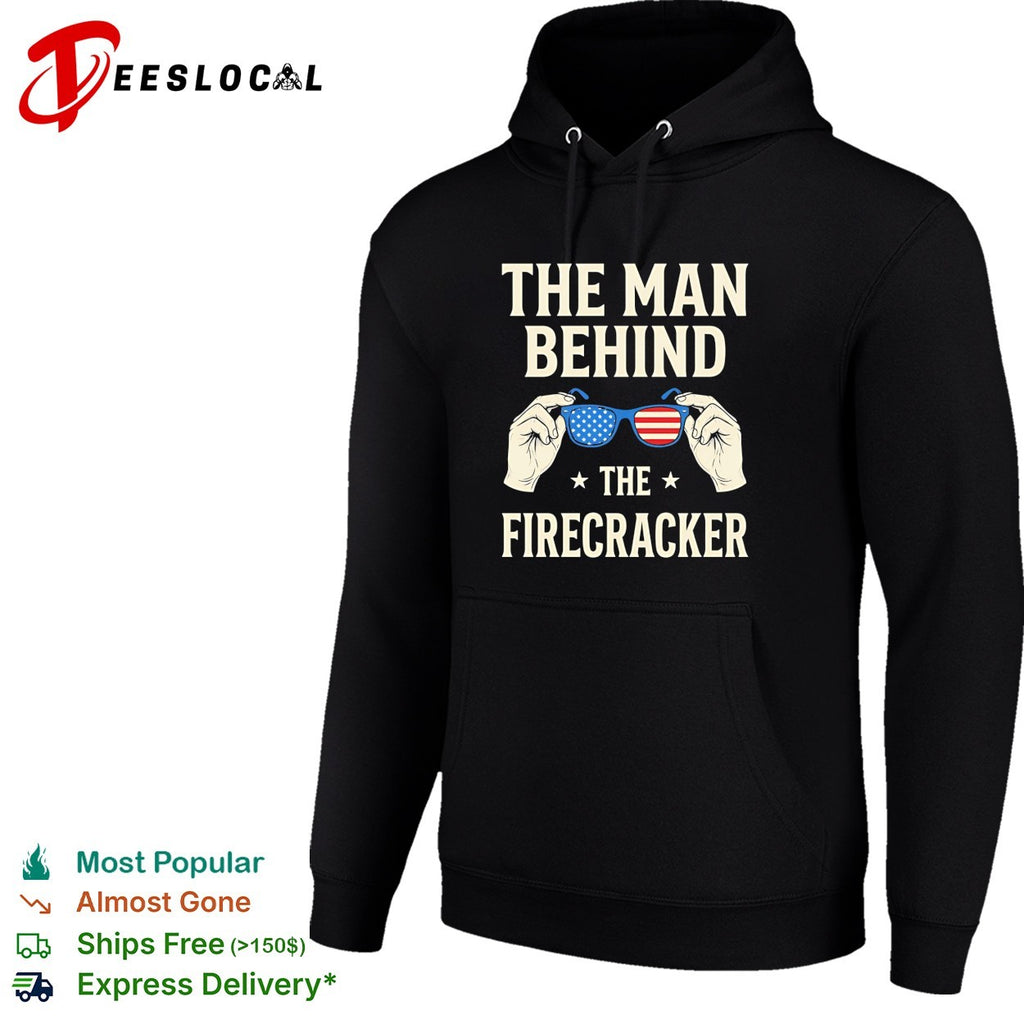 Holding sunglasses with USA flag pattern the man behind the firecracker retro shirt