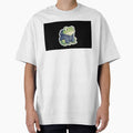 A cute, round frog looking confused, wearing a tiny hoodie. White border for sticker. by Yogeshrock